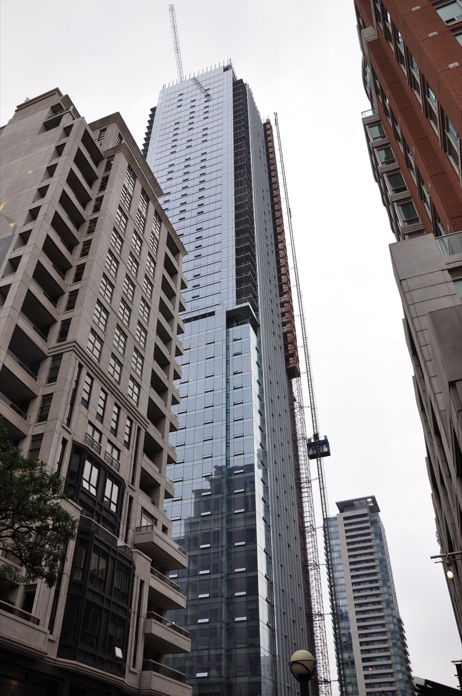 Glass towers rising above Yorkville, Toronto, the neighbourhood of the Four Seasons Hotel